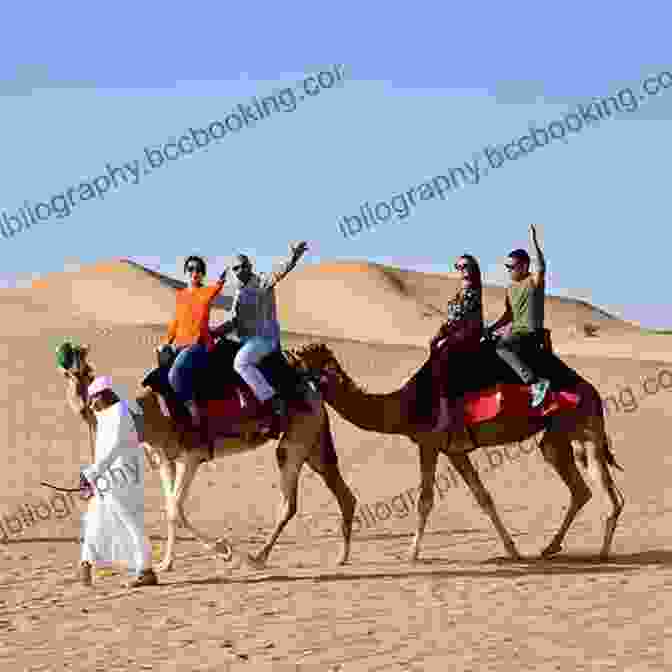 A Group Of Tourists Riding Camels Through The Sandy Dunes Of The Dubai Desert Dubai: Dubai Travel Guide: The 30 Best Tips For Your Trip To Dubai The Places You Have To See