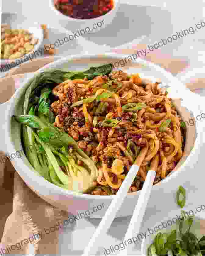 A Tantalizing Bowl Of Dan Dan Mian, Featuring Spicy Minced Pork, Fragrant Sesame Sauce, And Springy Noodles Chengdu: The City Of Gastronomy: The Ultimate Sichuan Food Guide